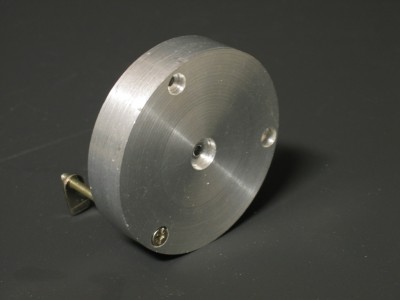 This is a alu disk, with a 3 mm hole in the centreto fix the hub and three  3mm holes at the outside for the rim.