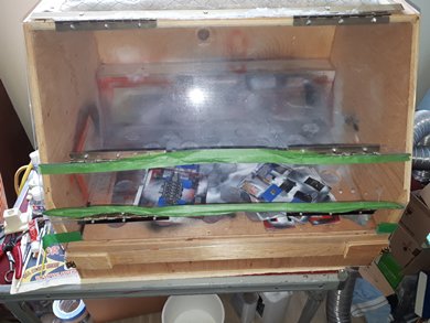 Spray Booth I built Plexiglass cover that folds up in 3 parts for use.
