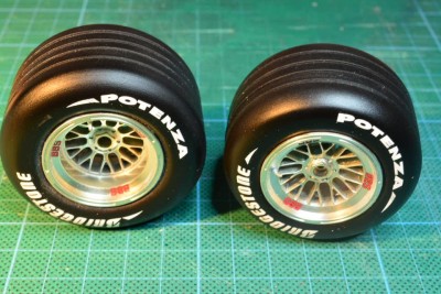 resin cast tires, painted black and decaled.Rims are from the Revell F1 2002.